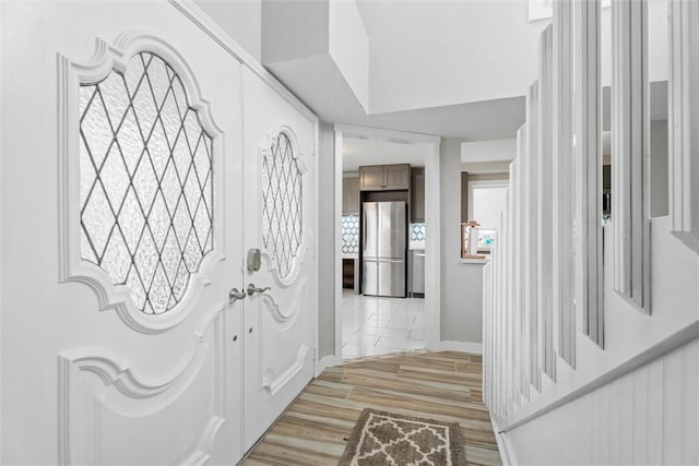 entrance foyer with light hardwood / wood-style flooring