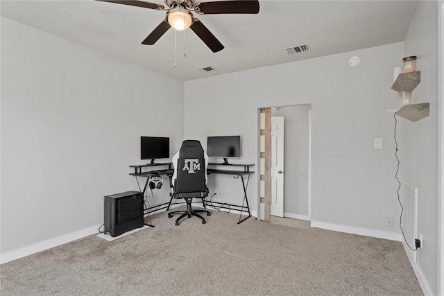 office featuring ceiling fan and light colored carpet