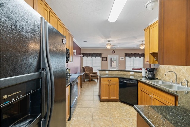 kitchen with black appliances, sink, light tile patterned floors, tasteful backsplash, and kitchen peninsula