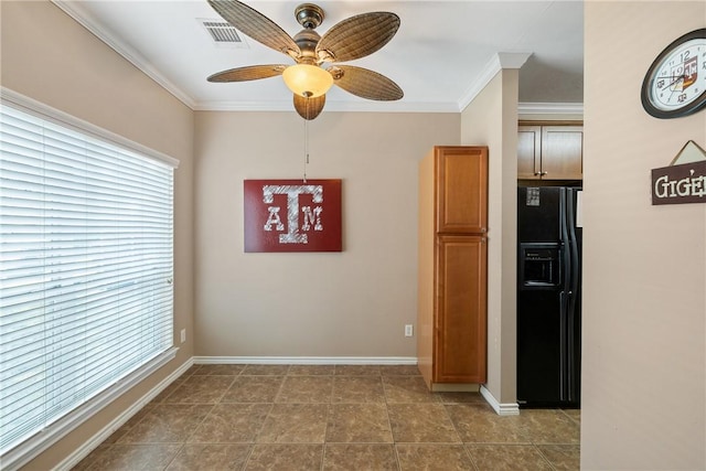 unfurnished room featuring ceiling fan and ornamental molding