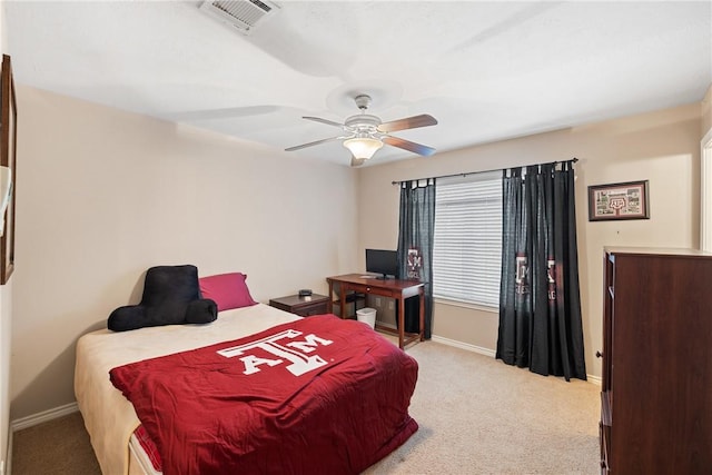 bedroom featuring light colored carpet and ceiling fan