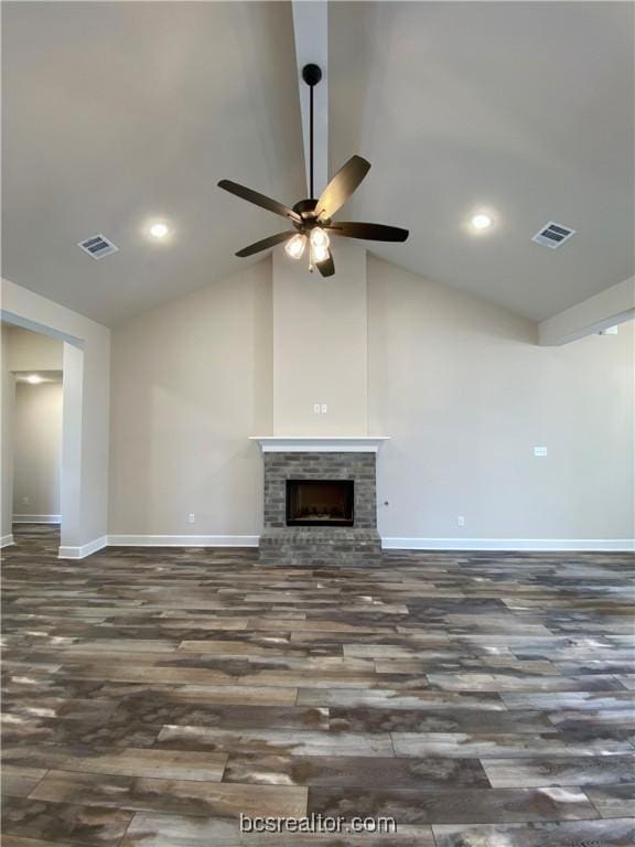 unfurnished living room with ceiling fan, dark hardwood / wood-style flooring, a fireplace, and high vaulted ceiling