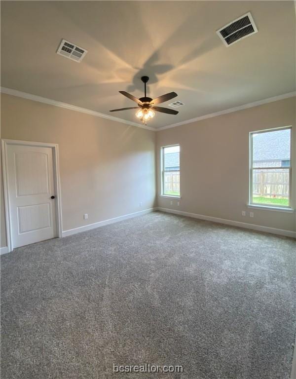 carpeted empty room with ceiling fan and ornamental molding