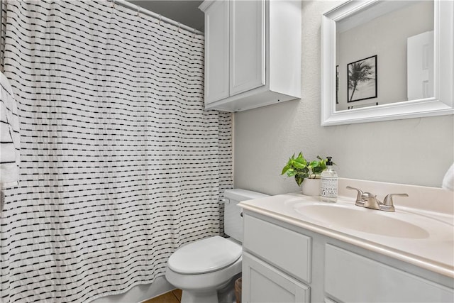 bathroom with vanity, toilet, and a shower with curtain