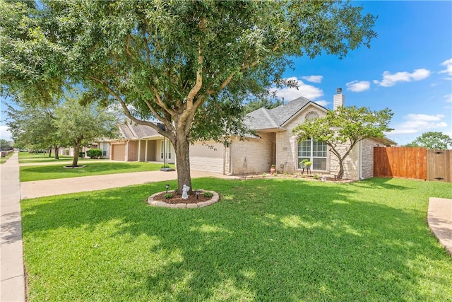 ranch-style home featuring a chimney, fence, a front lawn, concrete driveway, and an attached garage