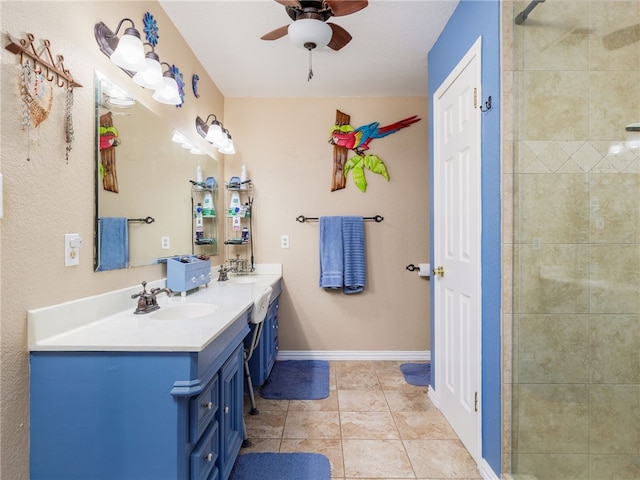 bathroom featuring ceiling fan, tile patterned flooring, and vanity