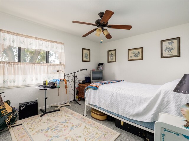 carpeted bedroom featuring ceiling fan