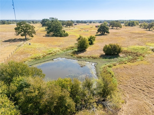 drone / aerial view with a rural view and a water view