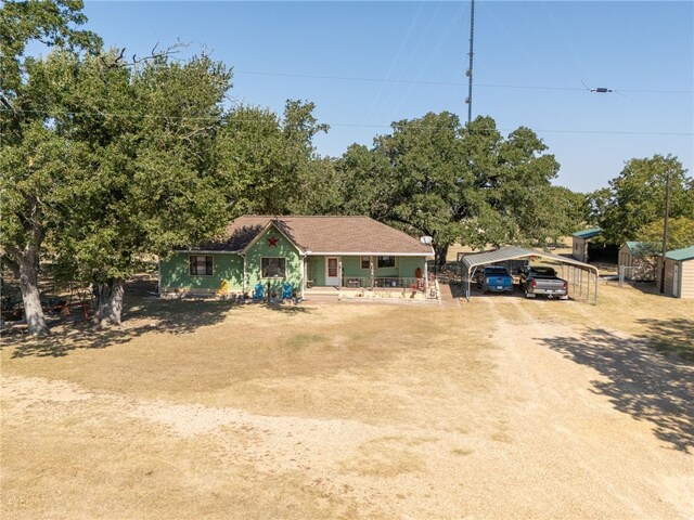 view of front of house featuring a porch and a carport