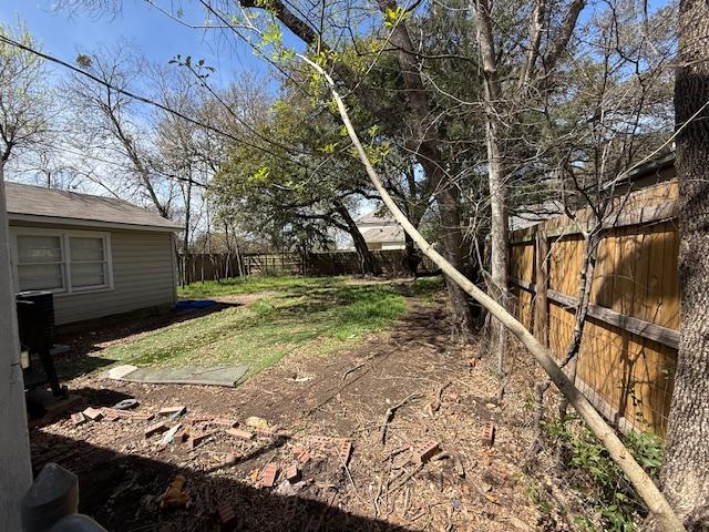 view of yard with a fenced backyard