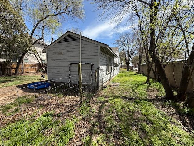 exterior space with a fenced backyard