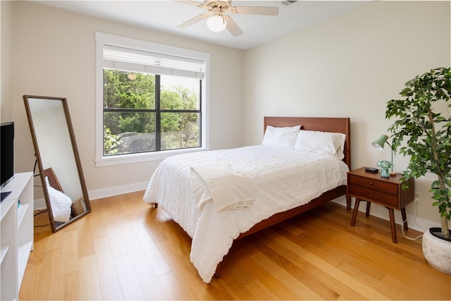 18140 Osage Trail Dr, College Station, TX 77845 - bedroom with light wood-style flooring, baseboards, and a ceiling fan