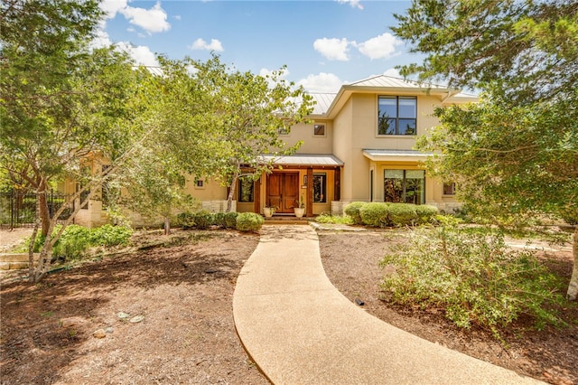18140 Osage Trail Dr, College Station, TX 77845 - view of front of property with a standing seam roof, metal roof, and stucco siding