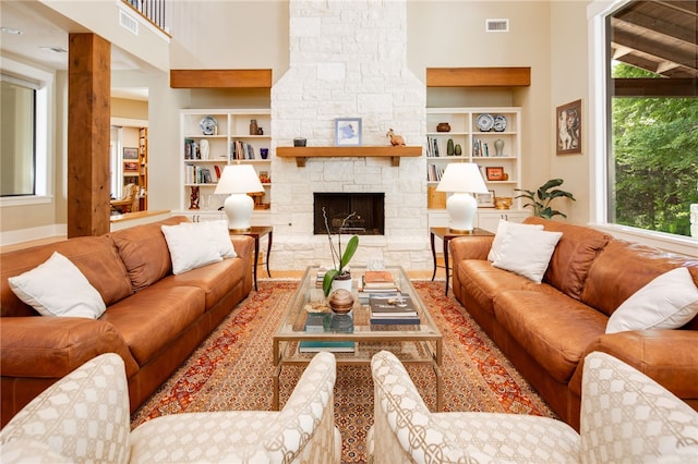 18140 Osage Trail Dr, College Station, TX 77845 - living room with built in shelves and a stone fireplace