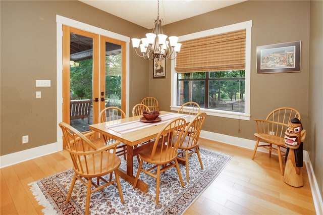 18140 Osage Trail Dr, College Station, TX 77845 - dining room with a chandelier, light wood finished floors, french doors, and baseboards