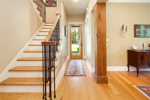 18140 Osage Trail Dr, College Station, TX 77845 - foyer with wood finished floors, stairway, and baseboards