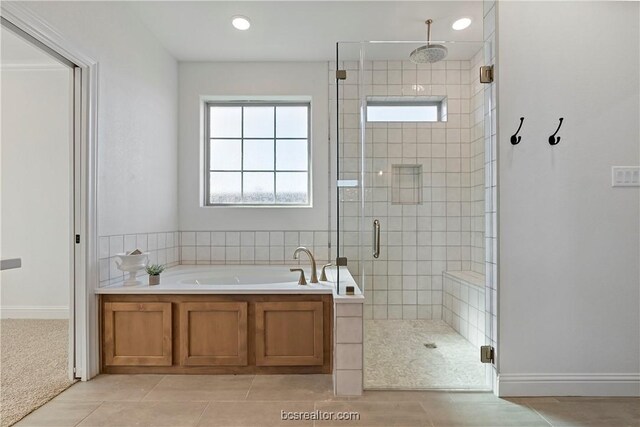 2160 Madden Cir, College Station, TX 77845 - full bathroom with a bath, a shower stall, and tile patterned floors