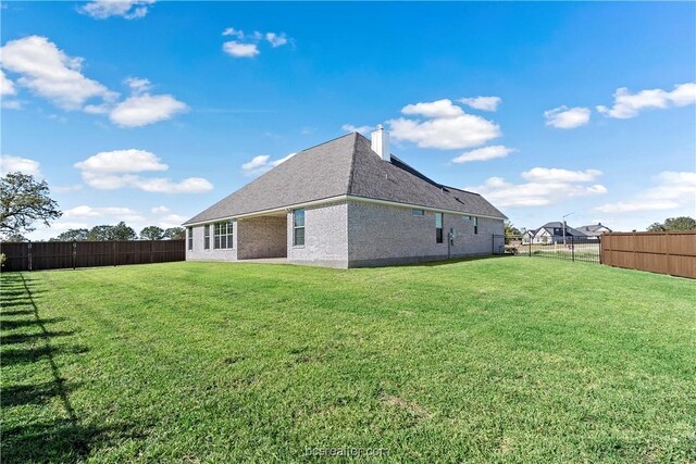 2160 Madden Cir, College Station, TX 77845 - back of property featuring a chimney and brick siding