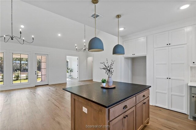 2160 Madden Cir, College Station, TX 77845 - kitchen featuring a chandelier, light wood-style flooring, dark countertops, open floor plan, and recessed lighting