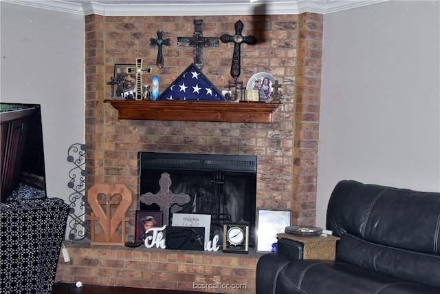 living room featuring a fireplace and crown molding