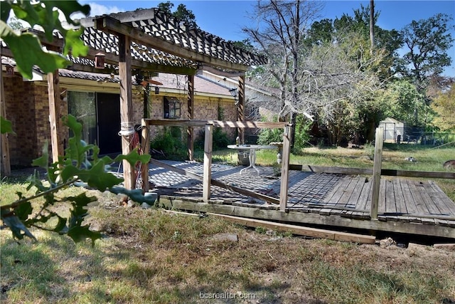 exterior space featuring a pergola and a wooden deck