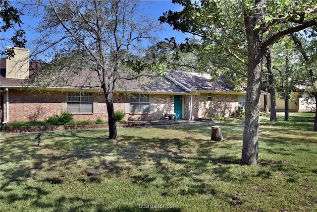 ranch-style home featuring a front yard