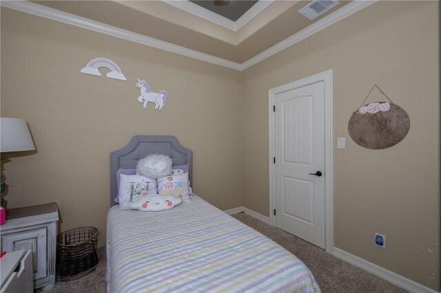 carpeted bedroom featuring crown molding, baseboards, and visible vents
