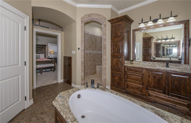full bathroom with a garden tub, crown molding, walk in shower, baseboards, and connected bathroom