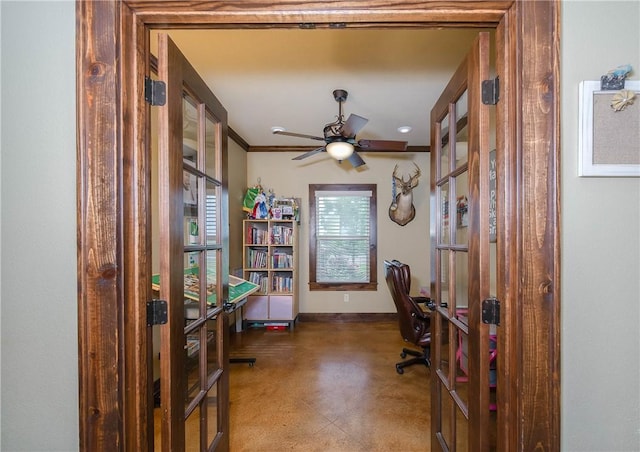 office space with french doors, a ceiling fan, baseboards, concrete floors, and ornamental molding