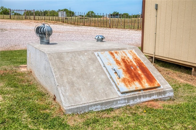 entry to storm shelter with fence