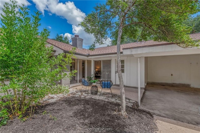 rear view of property featuring a patio