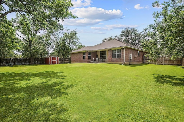 713 Broadmoor Dr, Bryan, TX 77802 - back of property with a storage shed, brick siding, and an outdoor structure