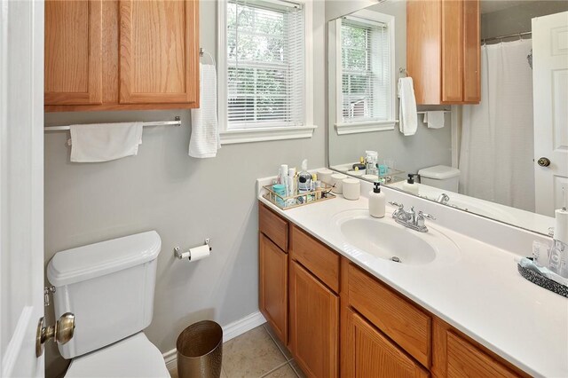 713 Broadmoor Dr, Bryan, TX 77802 - full bathroom with toilet, vanity, tile patterned floors, and baseboards