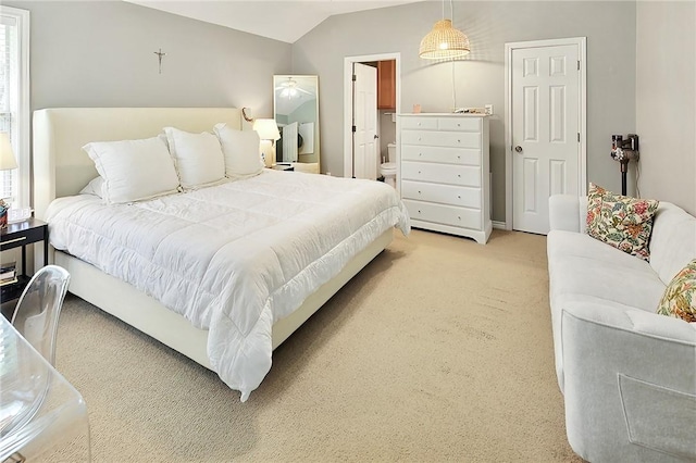 713 Broadmoor Dr, Bryan, TX 77802 - bedroom with light colored carpet, lofted ceiling, and connected bathroom