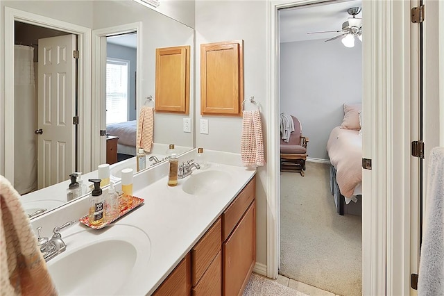 713 Broadmoor Dr, Bryan, TX 77802 - ensuite bathroom with a ceiling fan, double vanity, and baseboards