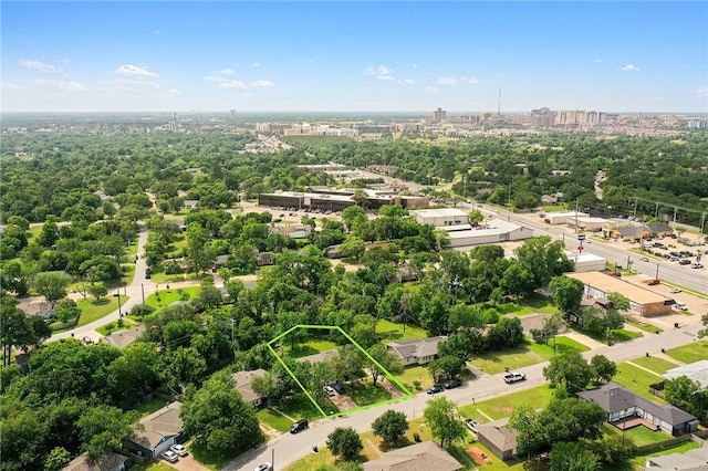 713 Broadmoor Dr, Bryan, TX 77802 - aerial overview of property's location with property boundaries highlighted and a tree filled landscape