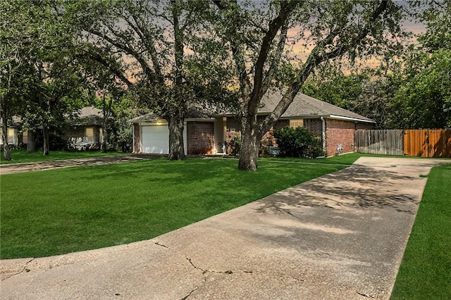 713 Broadmoor Dr, Bryan, TX 77802 - view of front facade featuring concrete driveway, brick siding, and an attached garage