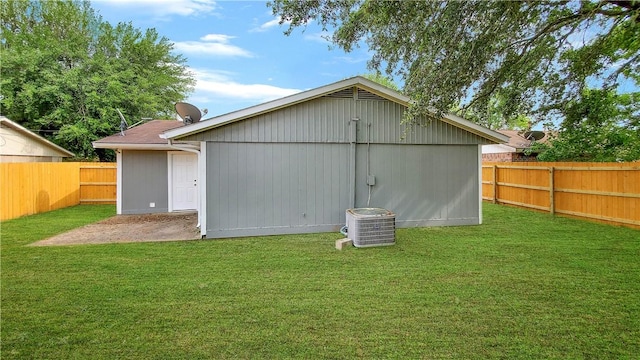 rear view of house with a yard