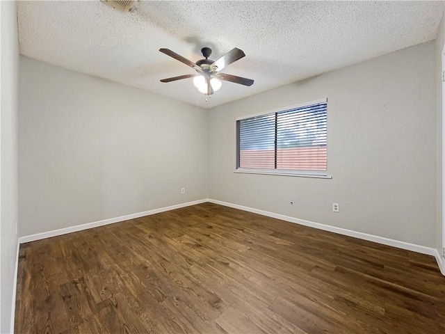 unfurnished room with a textured ceiling, dark hardwood / wood-style floors, and ceiling fan