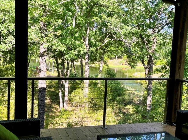 balcony featuring a water view