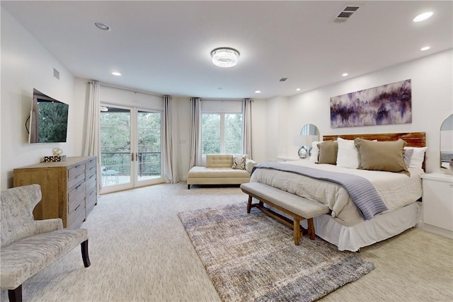 carpeted bedroom with access to exterior and french doors