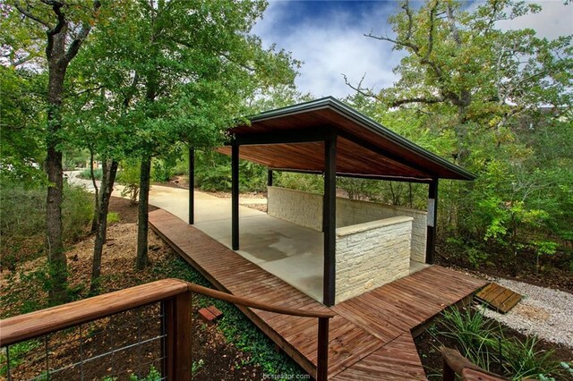 wooden deck featuring a patio area