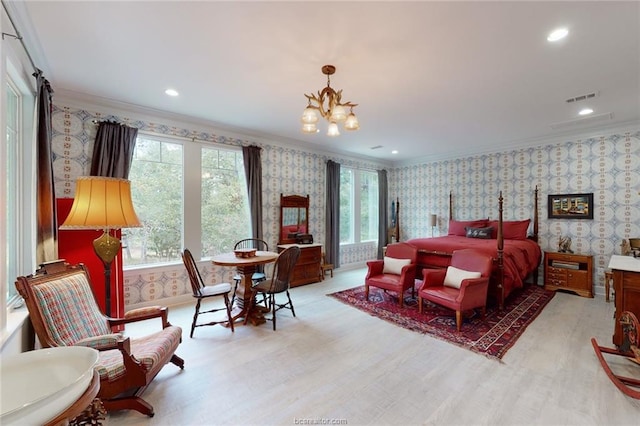 bedroom featuring ornamental molding and a chandelier