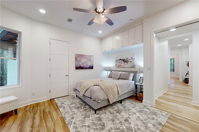 bedroom featuring ceiling fan and light hardwood / wood-style floors