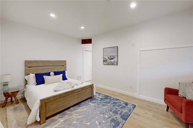 bedroom with light hardwood / wood-style flooring