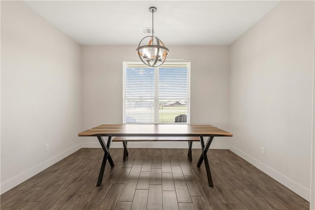 10146 Henley Cv, Iola, TX 77861 - dining area with baseboards, dark wood-style floors, and a chandelier