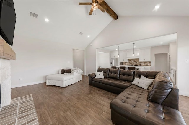 10146 Henley Cv, Iola, TX 77861 - living area with beamed ceiling, ceiling fan, light wood-style flooring, high vaulted ceiling, and a fireplace