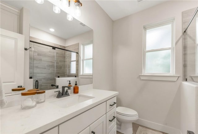 10146 Henley Cv, Iola, TX 77861 - bathroom with vanity, a tile shower, and toilet