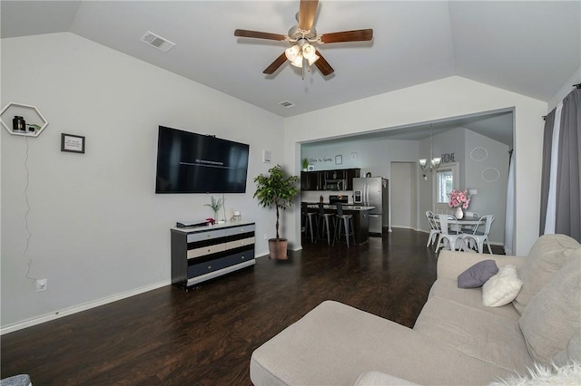 122 Dove Ct, Navasota, TX 77868 - living area featuring lofted ceiling, a ceiling fan, wood finished floors, and a chandelier