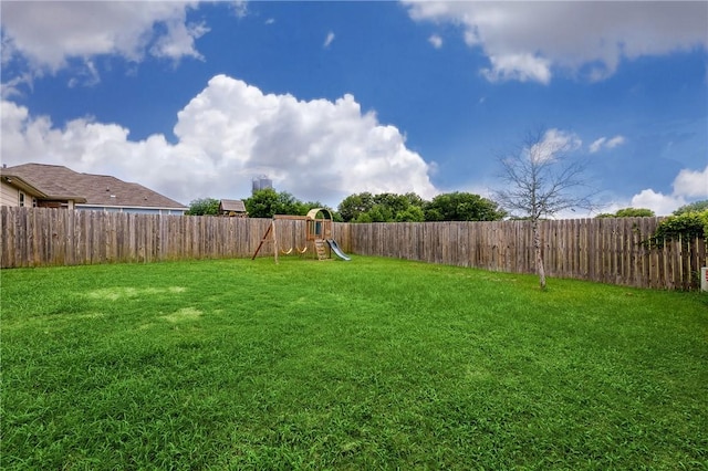 122 Dove Ct, Navasota, TX 77868 - fenced backyard with a playground